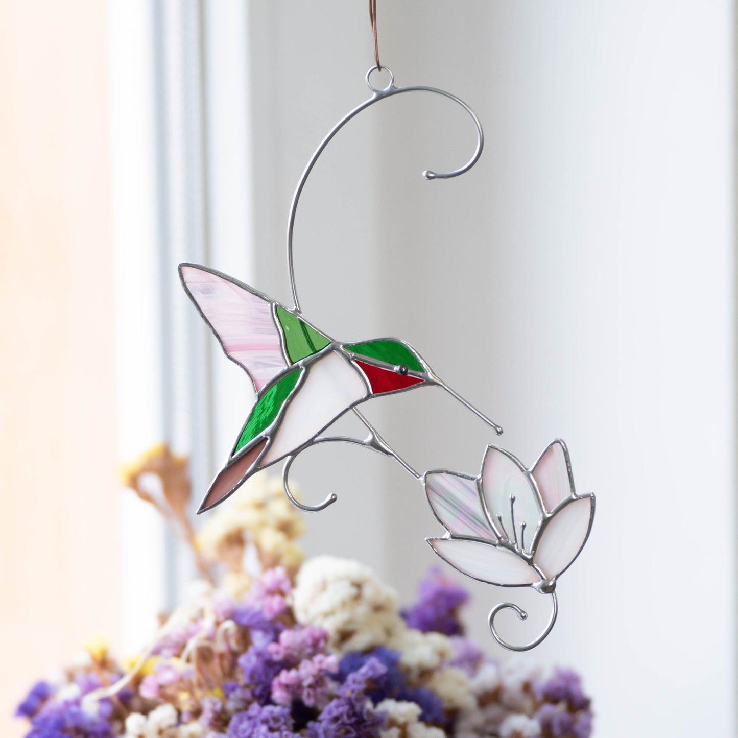 RUBY-THROATED HUMMINGBIRD WITH THE FLOWER