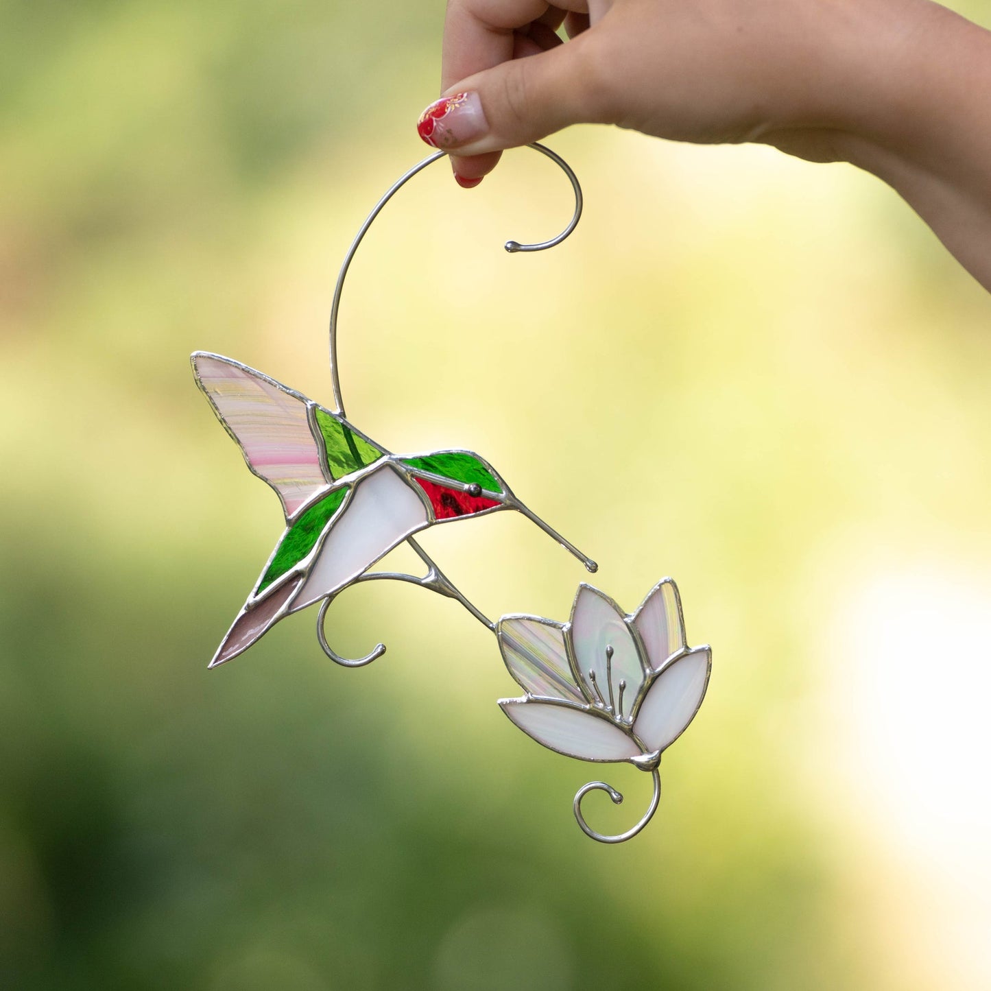 RUBY-THROATED HUMMINGBIRD WITH THE FLOWER