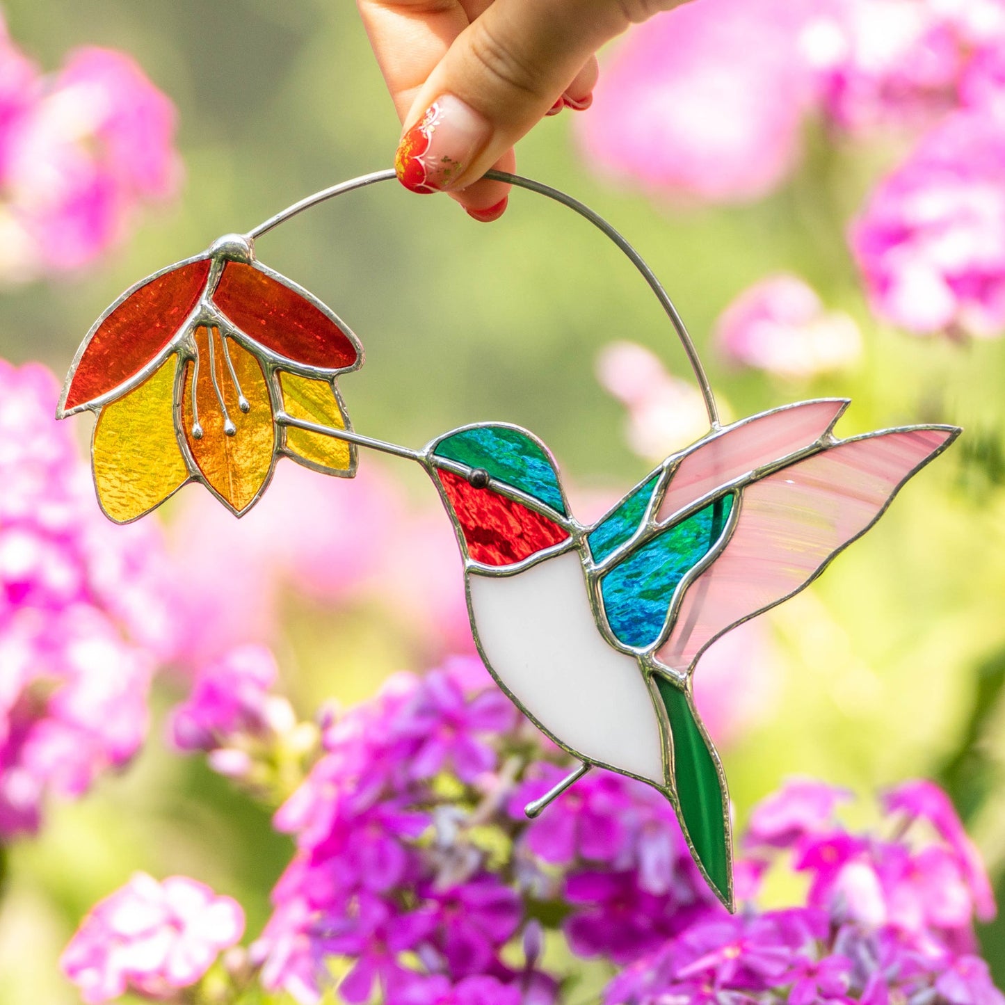 BUNTER KOLIBRI MIT BLUME