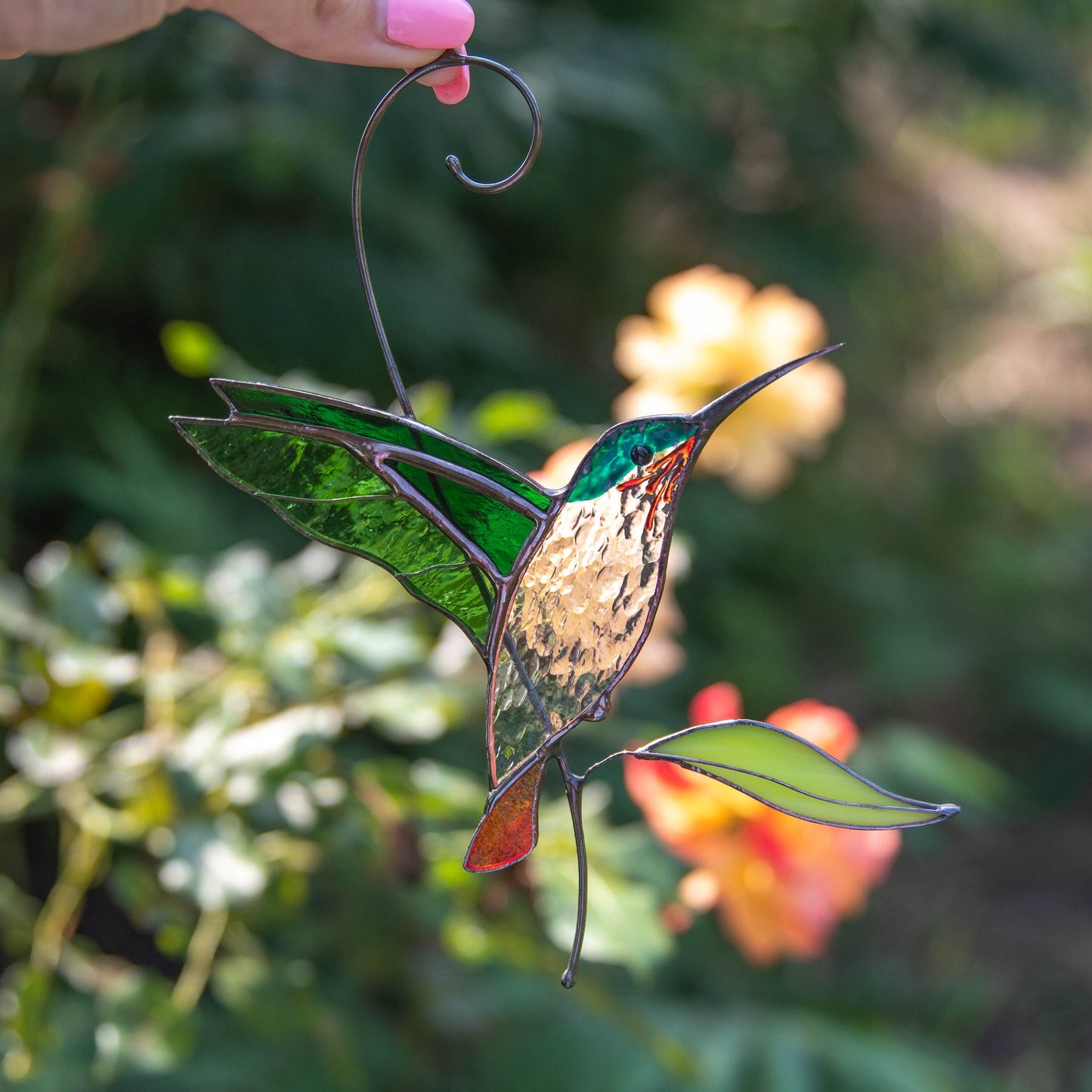 Sonnenfänger-Buntglas „Fliegender goldener Kolibri“