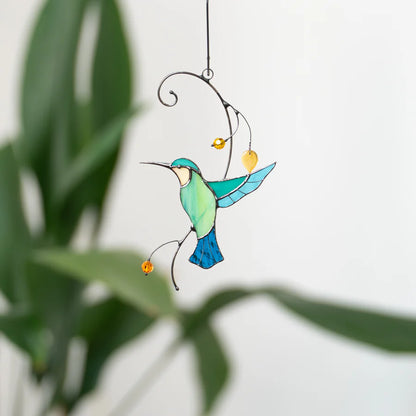 COlibris décollant d'une branche SUNCATCHER