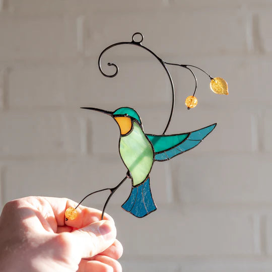 HUMMINGBIRD TAKING OFF FROM A BRANCH SUNCATCHER