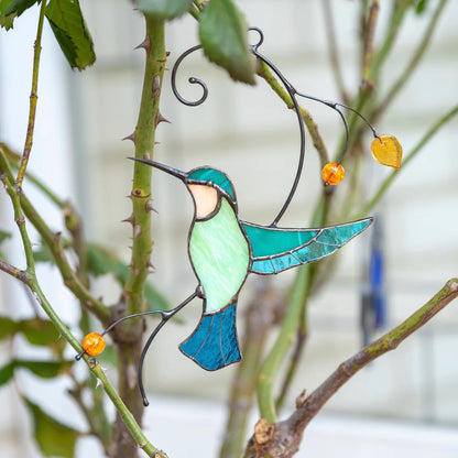 HUMMINGBIRD TAKING OFF FROM A BRANCH SUNCATCHER