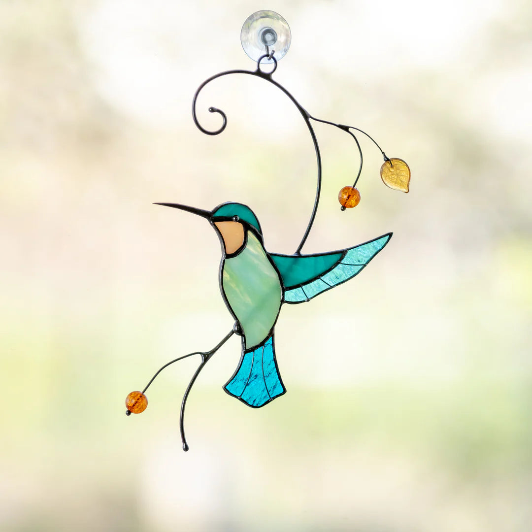 HUMMINGBIRD TAKING OFF FROM A BRANCH SUNCATCHER