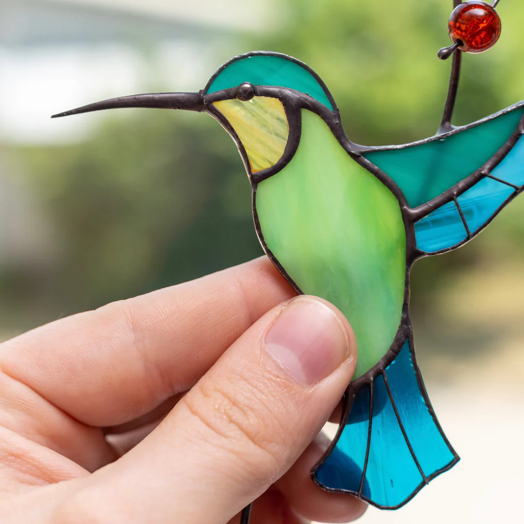 HUMMINGBIRD TAKING OFF FROM A BRANCH SUNCATCHER