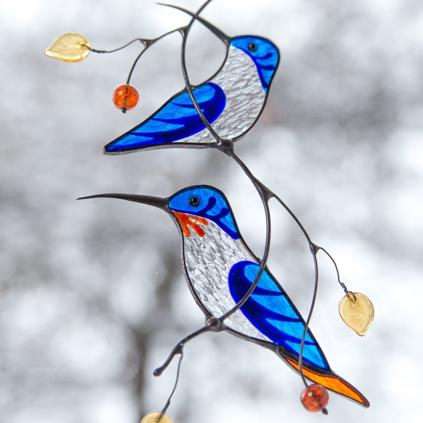 BLUE HUMMINGBIRDS ON THE BRANCH