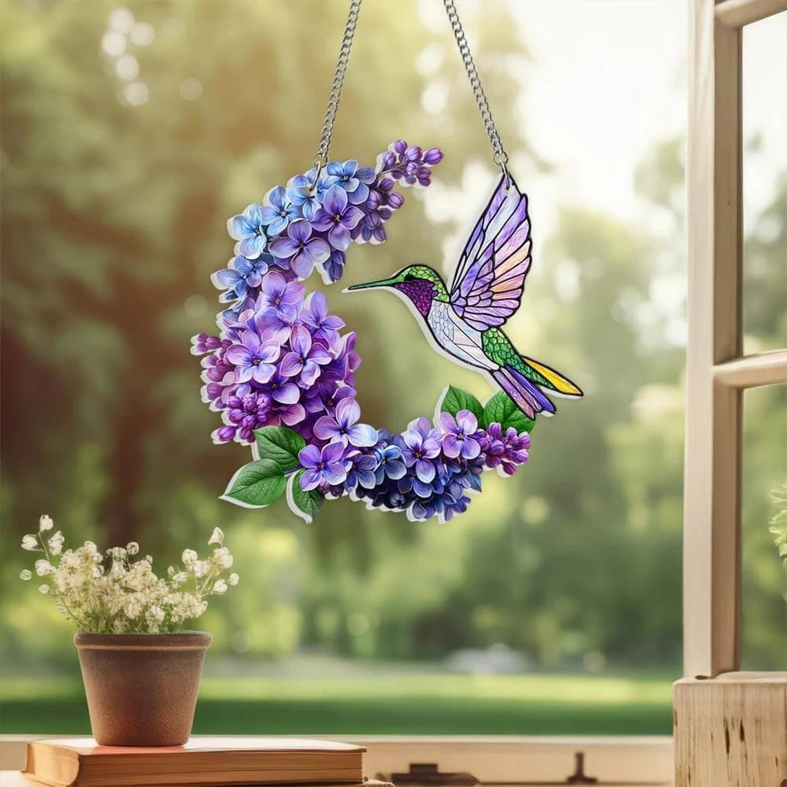 Upgrade your home decor with this stunning Hummingbird Acrylic Window hanging. Perfect for Lilac lovers, bird nerds, and anyone who appreciates beautiful home decor.