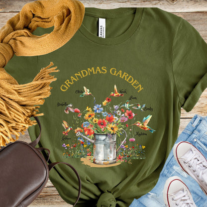 Grandmas Humming Birds Garden T-shirt Custom Grandkid Names Flower Filled Water Can Grandma T-Shirt Personalized Shirt Womens Shirt Trending